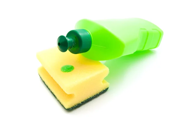 Esponja amarilla y botella verde —  Fotos de Stock