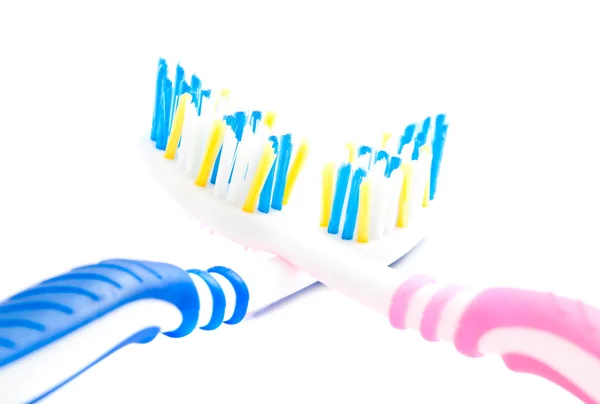 Cepillos de dientes azules y rosados primer plano — Foto de Stock