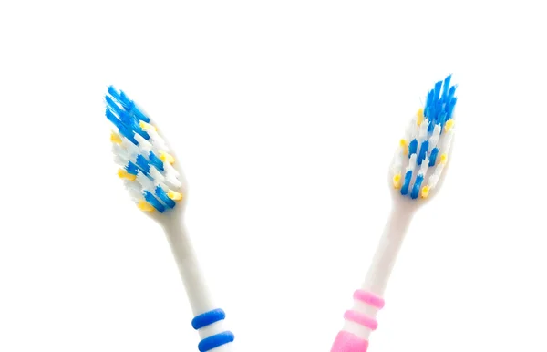 Cepillos de dientes azules y rosados — Foto de Stock