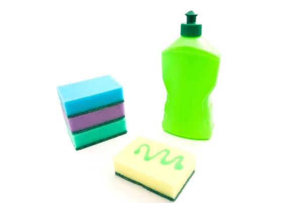 Botella y esponjas de colores — Foto de Stock