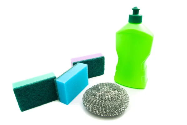 Bottle and different sponges on white — Stock Photo, Image