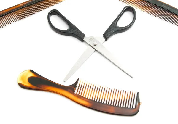 Three combs and scissors Stock Image