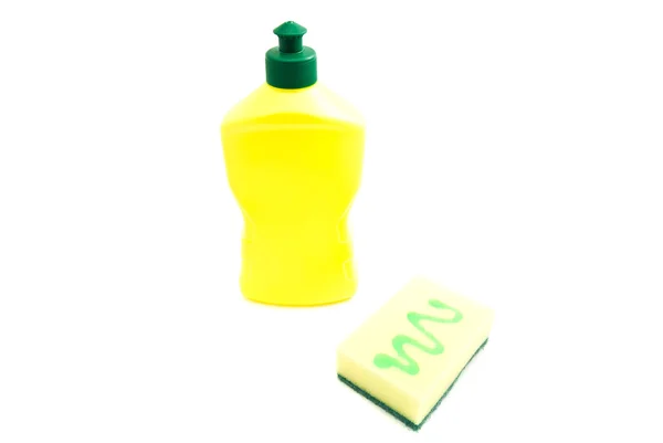 Yellow sponge and bottle on white — Stock Photo, Image
