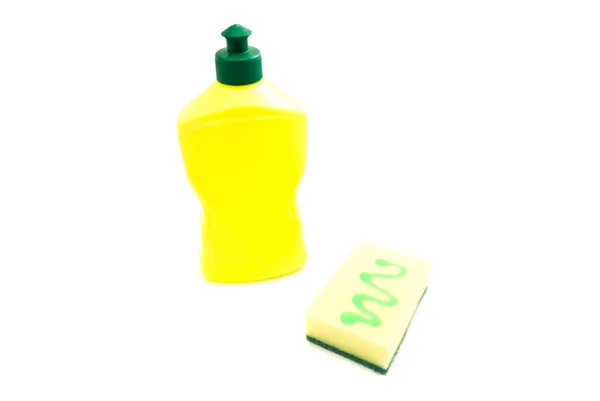 Желтая губка и бутылка — стоковое фото