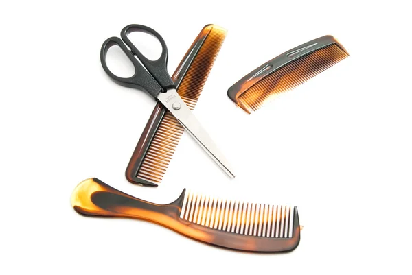 Different brown combs and scissors — Stock Photo, Image