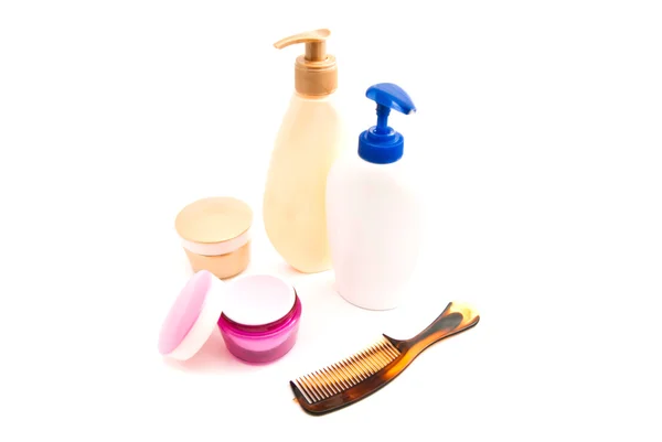 Shower gel, cream and hairbrush on white — Stock Photo, Image