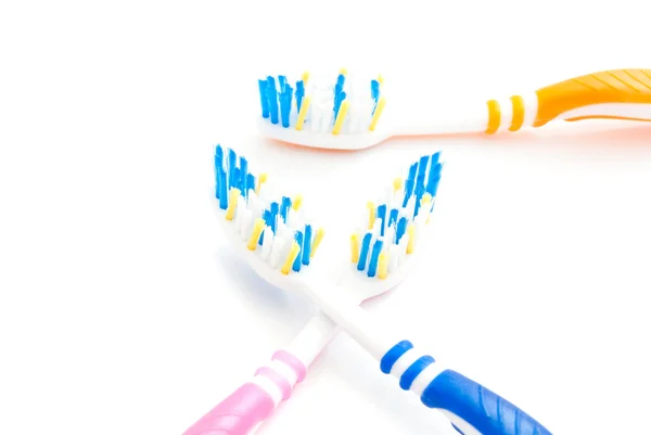 Tres cepillos de dientes de colores — Foto de Stock