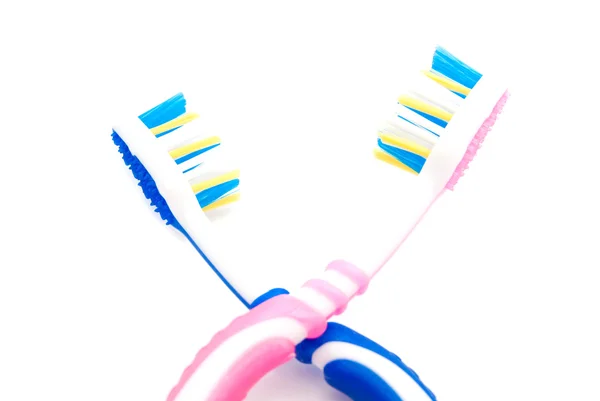 Cepillos de dientes azules y rosados — Foto de Stock