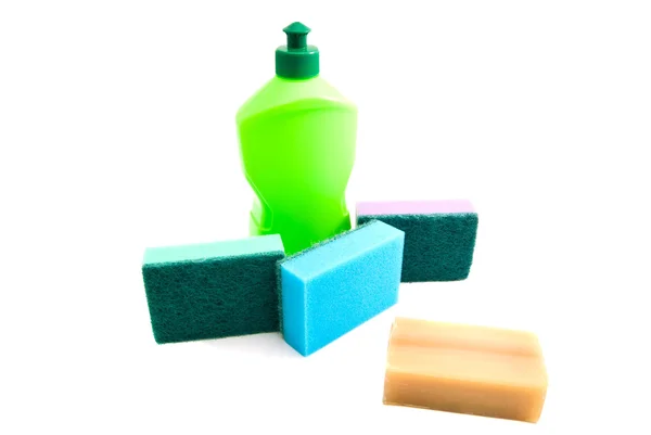 Botella verde, jabón, y diferentes esponjas —  Fotos de Stock