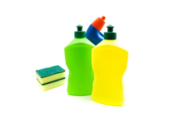 Drei Flaschen Waschmittel und Schwämme auf weiß — Stockfoto