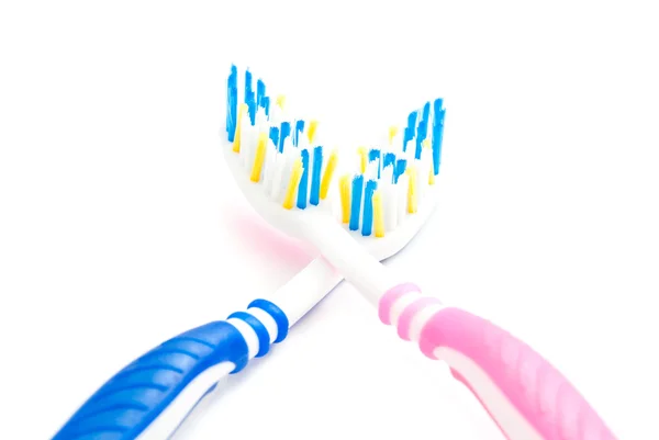 Pink and blue toothbrushes — Stock Photo, Image