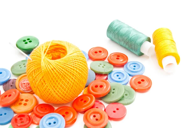 Needle, colored buttons and thread — Stock Photo, Image