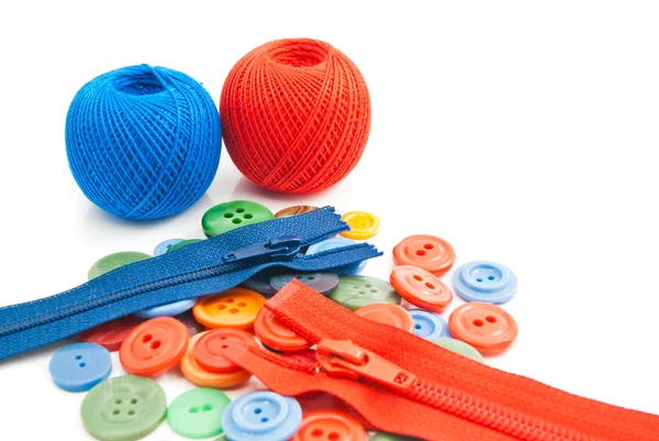 Buttons, tangles of thread and zippers — Stock Photo, Image