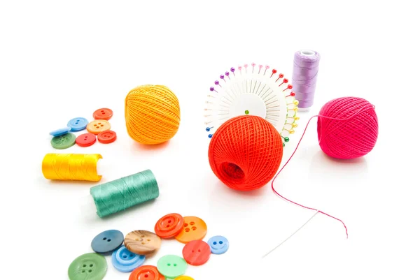 Pins, thread and colored buttons on white — Stock Photo, Image