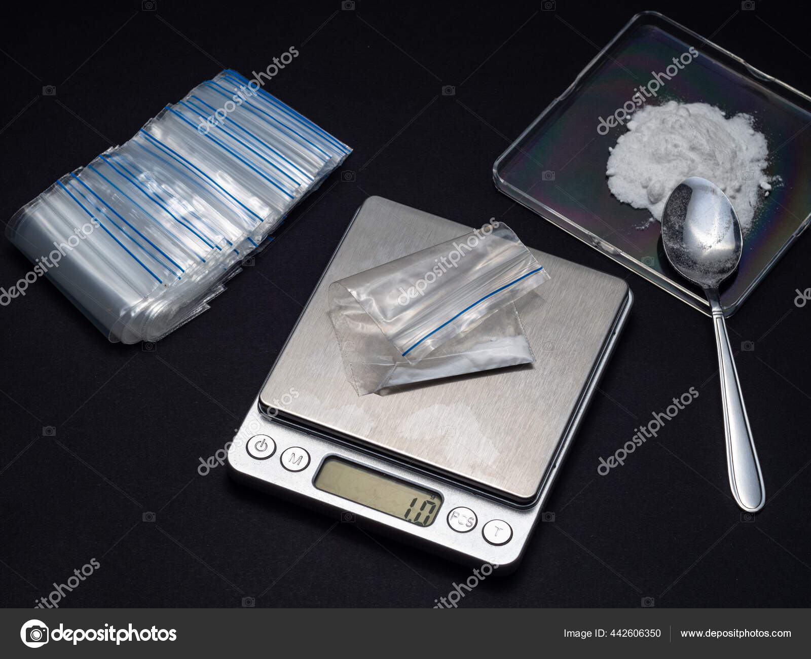 Weighing a drug dose using an electronic scale Stock Photo by ©tesunotai  442606350