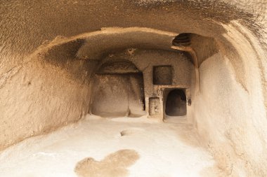 Travel to Georgia - room in an artificial ancient cave city in Vardzia. Most popular Georgian attraction