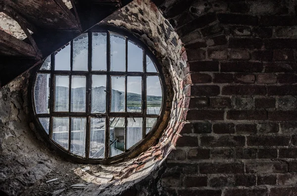 Round window in factory — Stock Photo, Image