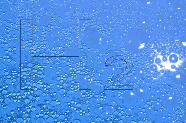 蓝色液体中的氢气H2字母 有许多圆圈 — 图库照片