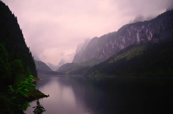 Lake and many mountains — Stock Photo, Image