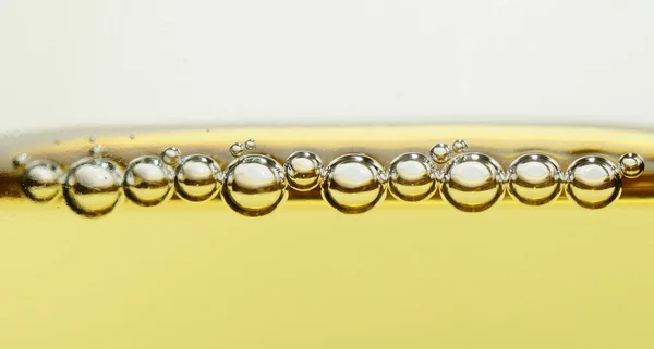 Pearls of champagne in glass closeup panorama — Stock Photo, Image