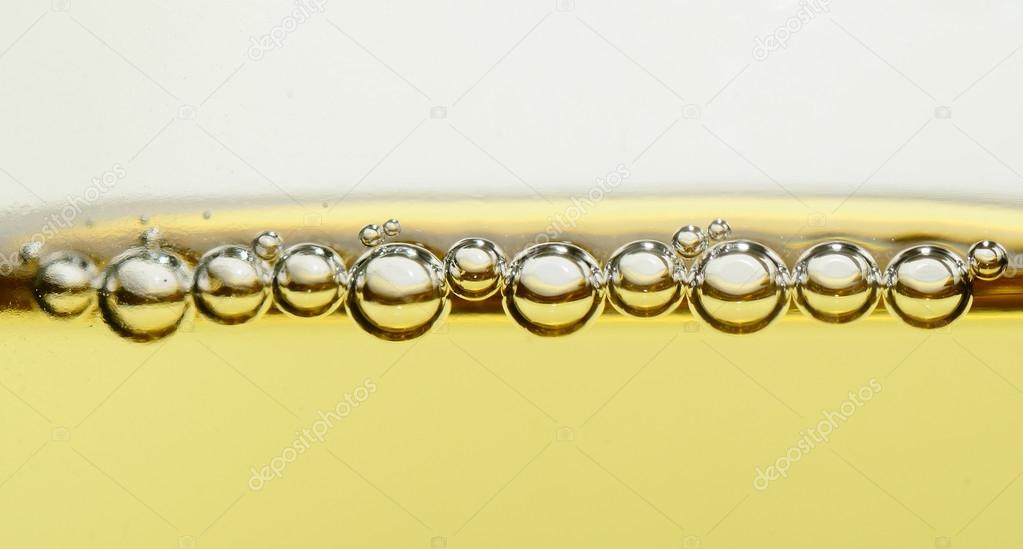 pearls of champagne in glass closeup panorama