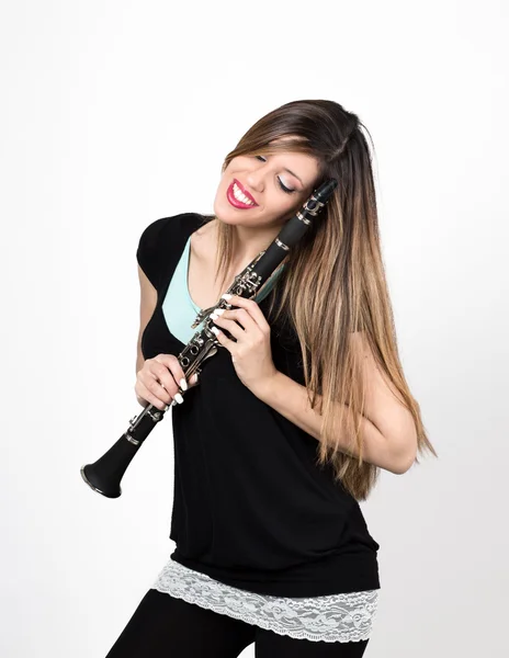 Woman in love with clarinet — Stock Photo, Image
