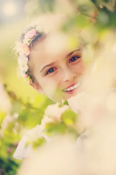 Rose garden - beautiful girl playing in the rose garden — Stock Photo, Image