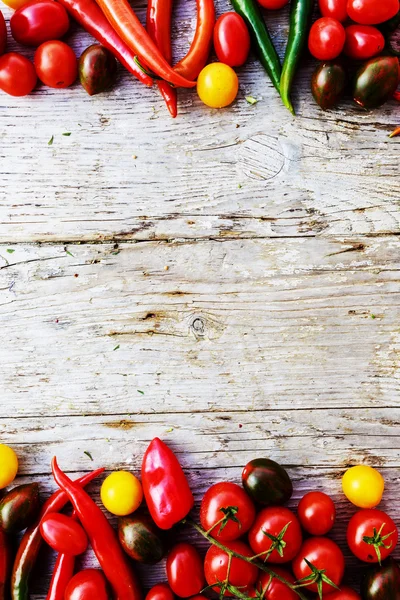 Vegetables over rustic wooden background — Stock Photo, Image