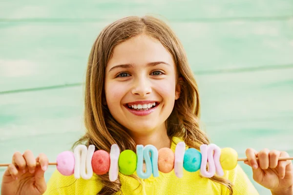 Young girl with sweets — Stock Photo, Image