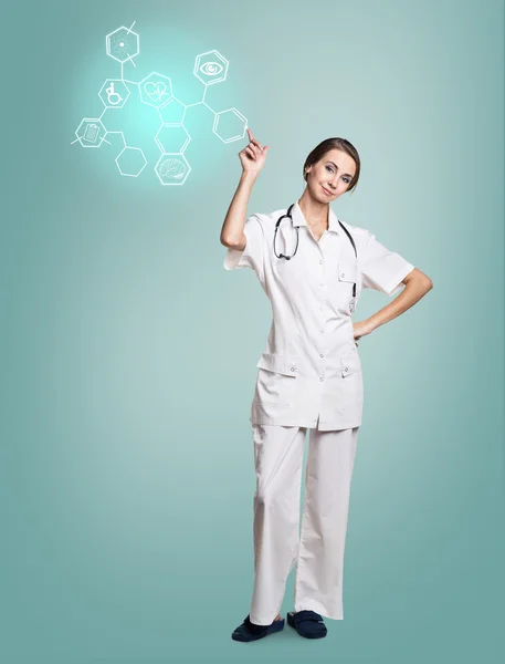 Vrouwelijke arts in uniforme touch zeshoek met pictogrammen — Stockfoto