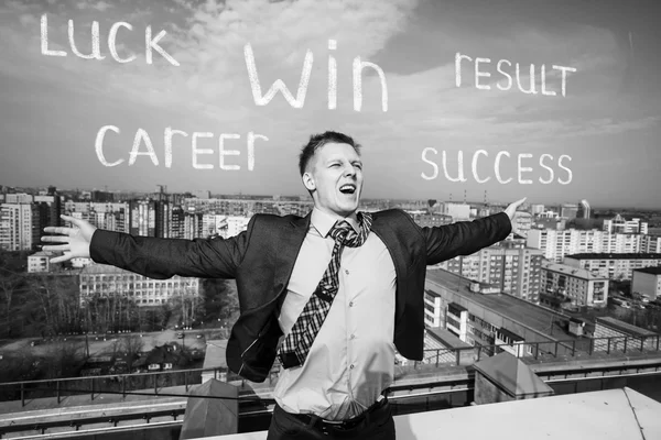 Cheerful businessman standing on the roof — Stock Photo, Image