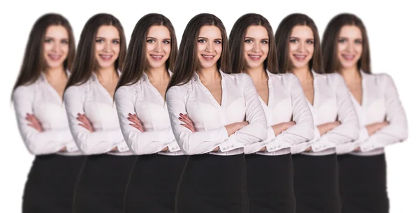 Mulheres clones de pé em uma fileira — Fotografia de Stock