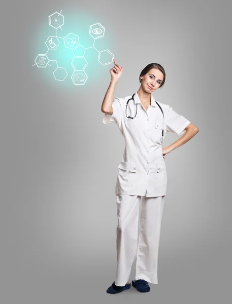 Vrouwelijke arts in uniforme touch zeshoek met pictogrammen — Stockfoto