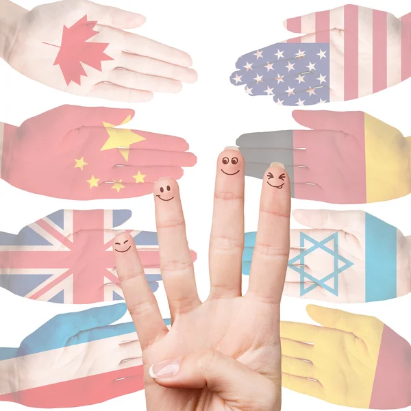 Many hands with different country flags — Stock Photo, Image