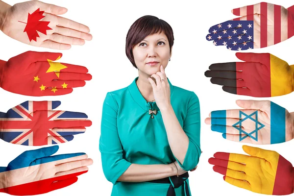 Mujer y muchas manos con diferentes banderas —  Fotos de Stock