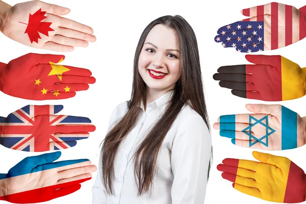 Mulher e muitas mãos com bandeiras diferentes — Fotografia de Stock