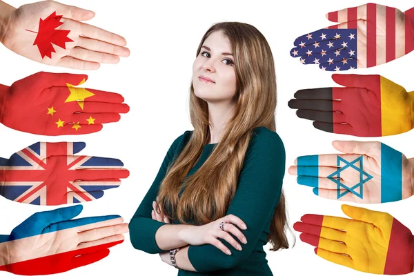 Woman and many hands with different flags — Stock Photo, Image