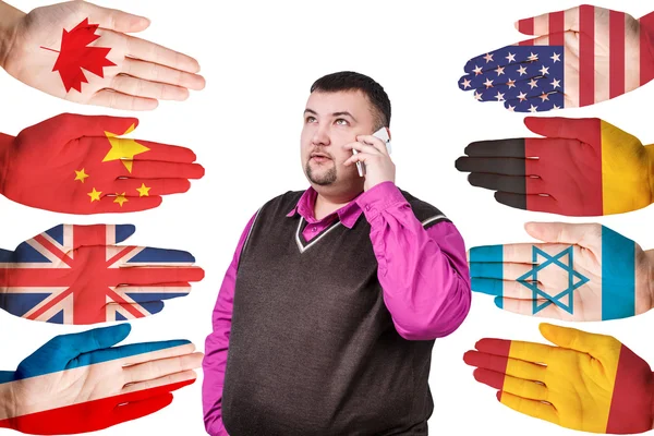 Businessman and many hands with different flags — Stock Photo, Image