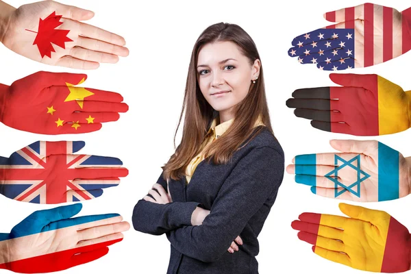 Woman and many hands with different flags — Stock Photo, Image