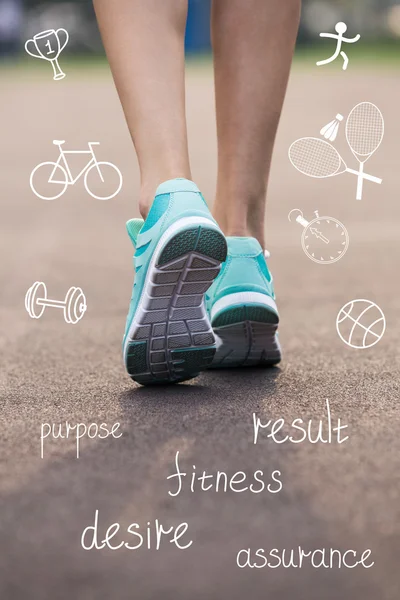 Woman feet in sneakers with sport icons — Stock Photo, Image