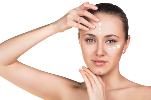 Girl with cream dots on face — Stock Photo, Image