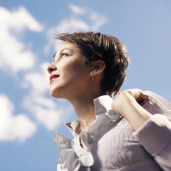 Young business woman looking up — Stock Photo, Image