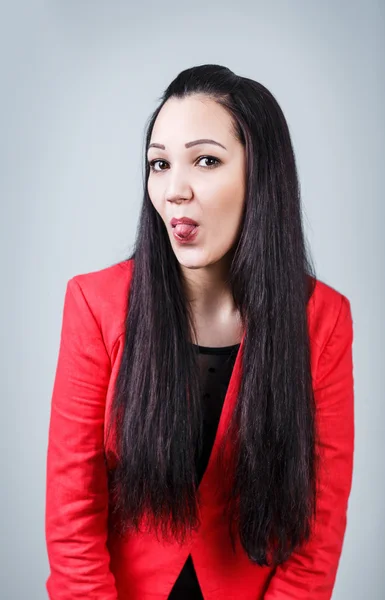 Mujer Yong sacando su lengua —  Fotos de Stock