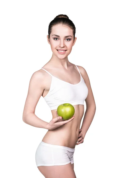 Mooie vrouw houdt groene appel. — Stockfoto