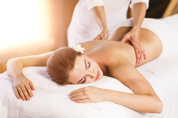 Beautiful young woman has massage — Stock Photo, Image