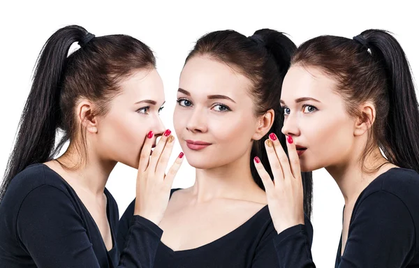 Three smiling girls whispering gossip — Stock Photo, Image