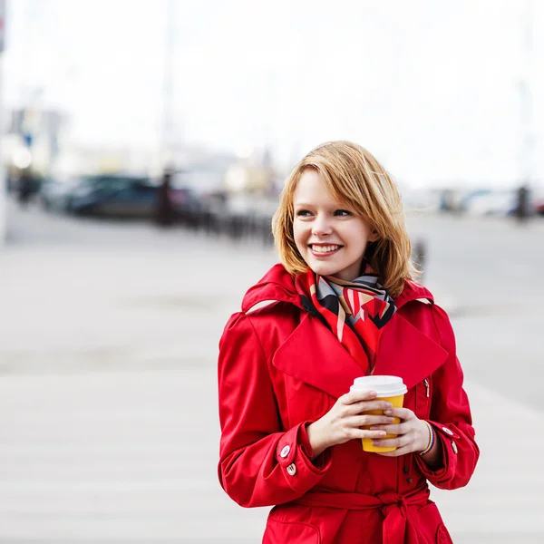 Young beautiful woman with to go coffee — Stock Photo, Image