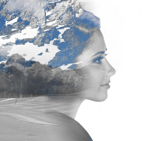 Double exposure portrait of girl and mountain