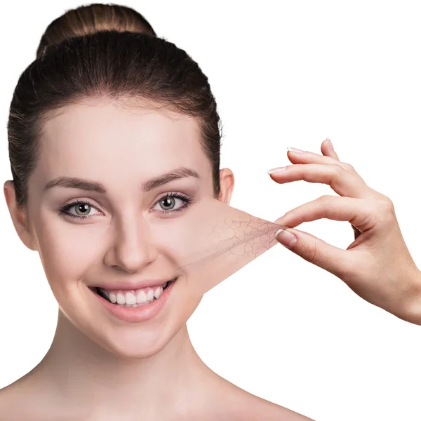 Hand trekken van de huid van de Wang van jonge vrouw — Stockfoto