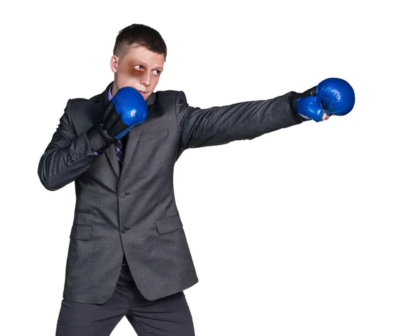 Empresário espancado com luvas de boxe — Fotografia de Stock